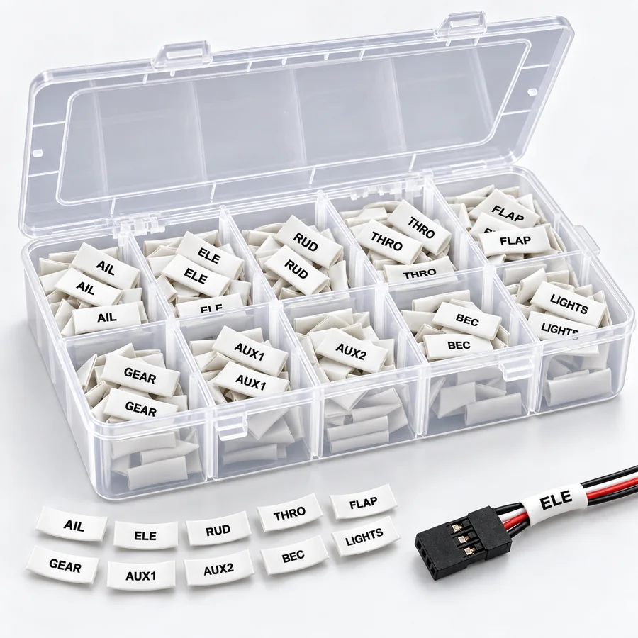 Deluxe Builder Pack: the reusable organizer open on white, each compartment holding one label type, with a row of loose labels and a labelled servo lead in front